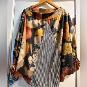 Women’s large shirt, can be worn off shoulder.